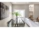 Modern dining space with a glass table, comfortable seating, and stylish decor at 43 N Walcott St, Indianapolis, IN 46201