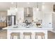 Stylish kitchen featuring a large white island, pendant lighting, and stainless steel appliances at 43 N Walcott St, Indianapolis, IN 46201