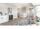 Open-concept living area with wet bar, wine fridge, light-colored wood floors, and stylish decor at 43 N Walcott St, Indianapolis, IN 46201