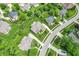 Birds eye view of beautiful brick home on well-manicured lawn with mature trees and a circular driveway at 4368 W Eagle Trce, New Palestine, IN 46163