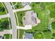 Aerial view of a lush green backyard with a wooden deck and professional landscaping at 4368 W Eagle Trce, New Palestine, IN 46163