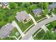 Aerial view of a home with a large backyard, wooden deck, and lush green landscaping in a residential neighborhood at 4368 W Eagle Trce, New Palestine, IN 46163