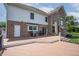 A spacious back deck with a grill overlooks a manicured lawn and mature trees, ideal for entertaining at 4368 W Eagle Trce, New Palestine, IN 46163