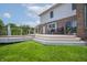 Spacious back deck with ample seating, grill, and seamless access to a large, green backyard at 4368 W Eagle Trce, New Palestine, IN 46163