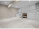 Finished basement featuring a fireplace and built-in bookshelves with carpeted flooring at 4368 W Eagle Trce, New Palestine, IN 46163