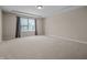 This bedroom features neutral walls and carpet, curtains and a window providing natural light at 4368 W Eagle Trce, New Palestine, IN 46163