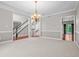 Formal dining room with chandelier and a view of the backyard at 4368 W Eagle Trce, New Palestine, IN 46163