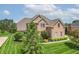 Attractive two-story brick home with well-maintained lawn and mature landscaping at 4368 W Eagle Trce, New Palestine, IN 46163
