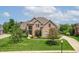 Beautiful two-story brick home featuring a manicured front yard and long driveway at 4368 W Eagle Trce, New Palestine, IN 46163