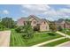 Exterior of a beautiful brick home with well-manicured landscaping and a lush green lawn at 4368 W Eagle Trce, New Palestine, IN 46163