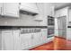 Beautiful kitchen boasting white cabinets, stainless steel appliances, and hardwood flooring at 4368 W Eagle Trce, New Palestine, IN 46163
