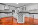 Spacious kitchen with white cabinets, granite counters, stainless appliances, and wine rack at 4368 W Eagle Trce, New Palestine, IN 46163