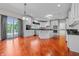Bright and airy kitchen featuring white cabinets, stainless steel appliances, and hardwood floors at 4368 W Eagle Trce, New Palestine, IN 46163