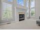 Living room features a fireplace and large windows providing ample natural light at 4368 W Eagle Trce, New Palestine, IN 46163