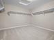 A walk-in closet with white walls and shelving at 4368 W Eagle Trce, New Palestine, IN 46163
