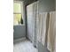 Bathroom featuring black and white tiled floor, a curtain and neutral color scheme at 4809 Allisonville Rd, Indianapolis, IN 46205
