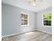 Inviting bedroom with ample natural light and light-colored laminate flooring at 4809 Allisonville Rd, Indianapolis, IN 46205