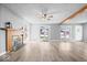 Inviting living room featuring modern flooring, a fireplace, and large windows for natural light at 4809 Allisonville Rd, Indianapolis, IN 46205