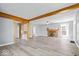 Well-lit living room with wood-burning fireplace, modern floors, and an open layout at 4809 Allisonville Rd, Indianapolis, IN 46205