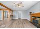 Spacious living area with hardwood floors, a fireplace, and plenty of natural light from the windows at 4809 Allisonville Rd, Indianapolis, IN 46205