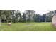 Picturesque backyard featuring a fire pit, swing, and mature trees at 5725 W 200 N, Lebanon, IN 46052