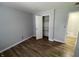 Bedroom showcasing a closet with shelving and door leading to the bathroom at 5725 W 200 N, Lebanon, IN 46052