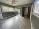 Bedroom with neutral paint, carpet flooring, fan, and large closet mirror at 5725 W 200 N, Lebanon, IN 46052