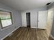 Bedroom with wood-look floors and a closet area to the right of the window at 5725 W 200 N, Lebanon, IN 46052