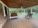 Relaxing covered porch with a ceiling fan, swing, and bench, perfect for enjoying the outdoors at 5725 W 200 N, Lebanon, IN 46052