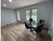 Cozy dining area with a glass table and a view of the backyard deck at 5725 W 200 N, Lebanon, IN 46052