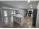 Open kitchen featuring an island with modern lighting and stainless steel appliances at 5725 W 200 N, Lebanon, IN 46052