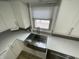 Stainless steel farmhouse sink with modern faucet and bright window view at 5725 W 200 N, Lebanon, IN 46052