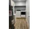 Laundry room area including a washer, dryer, laundry sink and overhead storage at 5725 W 200 N, Lebanon, IN 46052