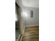 Corner in living space featuring wood-look flooring, a lamp, and a sliding glass door at 5725 W 200 N, Lebanon, IN 46052