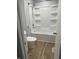 Clean shower and tub combination with a shower head, faucet, and storage at 5725 W 200 N, Lebanon, IN 46052