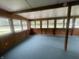 Spacious sunroom with a lot of windows and wood paneled walls and ceilings at 5725 W 200 N, Lebanon, IN 46052