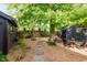 Backyard with wood fencing, mulch cover, a stone paver path and outdoor seating at 584 S 10Th St, Noblesville, IN 46060