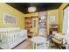 Bright Bedroom with hardwood floors and a sliding wooden barn door at 584 S 10Th St, Noblesville, IN 46060