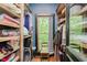 Walk-in closet with wood floor and open shelving at 584 S 10Th St, Noblesville, IN 46060