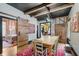 Well-appointed dining area with wood table, leading to a bedroom with a barn door at 584 S 10Th St, Noblesville, IN 46060