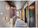 Hallway showcasing hardwood floors, neutral walls, and decorative rugs, creating a warm and inviting transition space at 584 S 10Th St, Noblesville, IN 46060