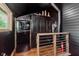 Eclectic interior with a black Galanz mini fridge and wooden safety railing at 584 S 10Th St, Noblesville, IN 46060