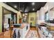 View of an open concept kitchen and living space featuring hardwood floors and a vintage aesthetic at 584 S 10Th St, Noblesville, IN 46060
