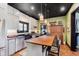 Spacious kitchen featuring modern appliances, a large island, and ample cabinet space at 584 S 10Th St, Noblesville, IN 46060