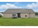 Charming home with a welcoming backyard, patio seating, and a well-manicured lawn at 608 Fisher Creek Dr, Indianapolis, IN 46239