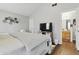 Comfortable bedroom featuring a bed, TV, and access to the bathroom at 608 Fisher Creek Dr, Indianapolis, IN 46239
