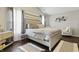 Cozy bedroom with a comfortable bed, hardwood floors, and neutral decor at 608 Fisher Creek Dr, Indianapolis, IN 46239