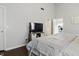 Bright bedroom with a TV on a console and an open bathroom doorway at 608 Fisher Creek Dr, Indianapolis, IN 46239
