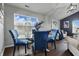 The dining area offers a modern table and chairs by a window, perfect for enjoying meals and natural light at 608 Fisher Creek Dr, Indianapolis, IN 46239