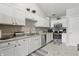 Bright kitchen features white cabinets, stainless steel appliances, and plenty of counter space at 608 Fisher Creek Dr, Indianapolis, IN 46239